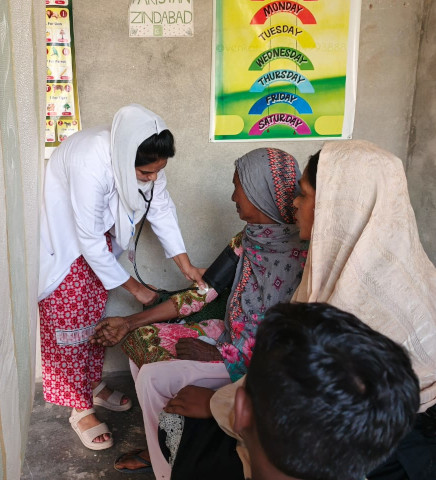 Nurse assisting a patient.